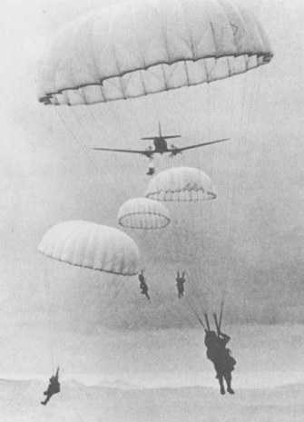 French paratroopers dropping from a transport plane.